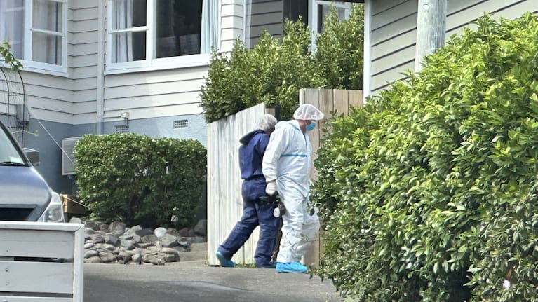Forensics at the scene of a home invasion where a resident received minor injuries in Wellington's Miramar.