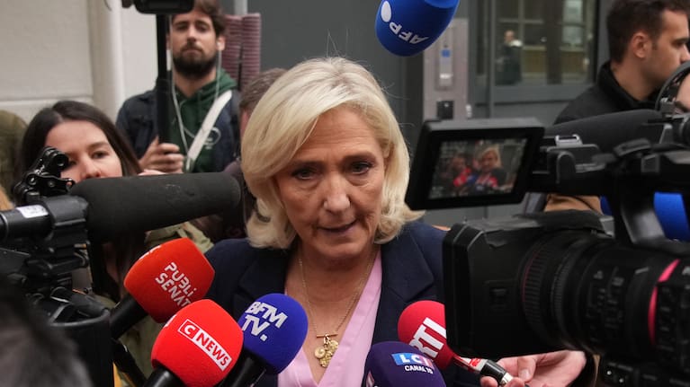 French far right leader Marine Le Pen talks to the media following a meeting at the National Rally party headquarters, after France's prime minister Sebastien Lecornu resigned .