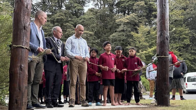 From left, Whanganui mayor Andrew Tripe, Ruapehu mayor Weston Kirton, Minister Tama Potaka and tamariki from Te Kura Kaupapa Māori o Ngāti Rangi.