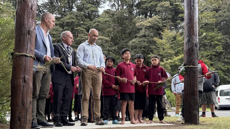 From left, Whanganui mayor Andrew Tripe, Ruapehu mayor Weston Kirton, Minister Tama Potaka and tamariki from Te Kura Kaupapa Māori o Ngāti Rangi.