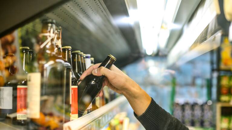 Generic photo of person buying beer