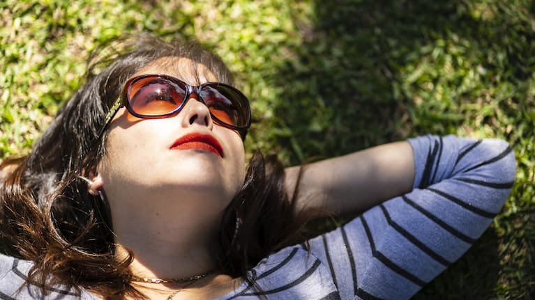 A member of Gen Z takes a wellness break to watch the clouds while working from home.