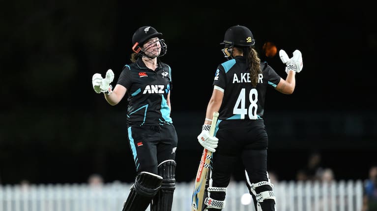 Georgia Plimmer (left) of New Zealand celebrates her half century with Amelia Kerr (right) during the Third T20I match between Australia and the White Ferns.
