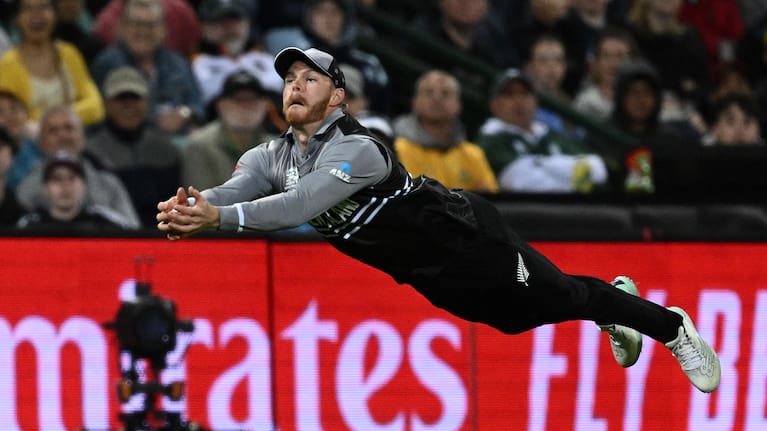 Glenn Phillips dives for a catch against Australia at the T20 World Cup.
