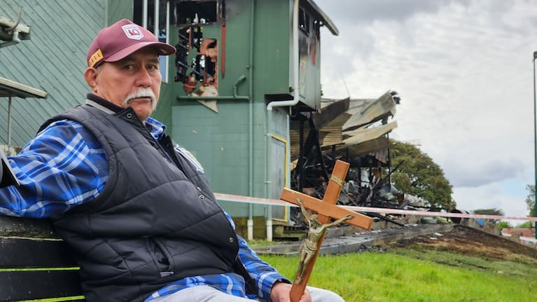 Hans Wulf sits on a bench outside the club.
