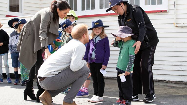 The Duke and Duchess of Sussex attempting to coax a smile from 5-year-old Joe Young while meeting with students from Houghton Valley School after their meeting with mental health project representatives at Maranui Cafe in Wellington. POOL. 29 October, 2018.  NZ Herald photograph by Mark Mitchell