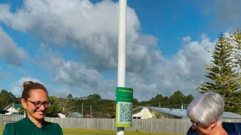 he unveiling of the Tiwhatiwha QR information sign and reading was completed by resident Lynn Vowles with support by Mayor Faylene Tunui, left.