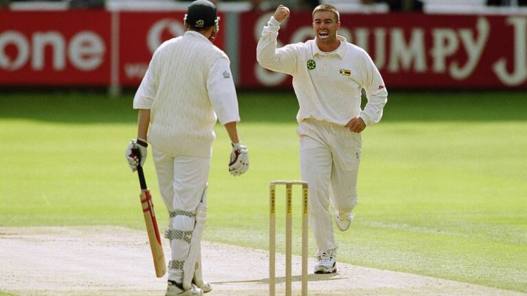 Heath Streak of Zimbabwe takes the wicket of Michael Atherton in May 2000.