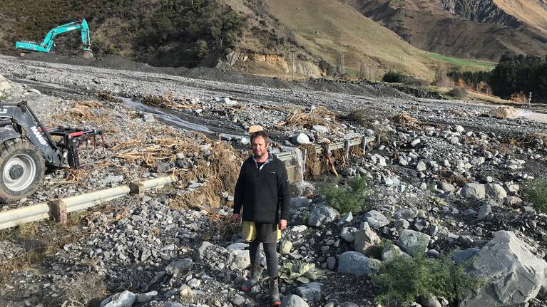 High country farmer Ross Bowmar stands in front of what used to be a bridge.
