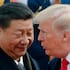 In this Nov. 9, 2017, file photo, US President Donald Trump, right, chats with Chinese President Xi Jinping during a welcome ceremony at the Great Hall of the People in Beijing.