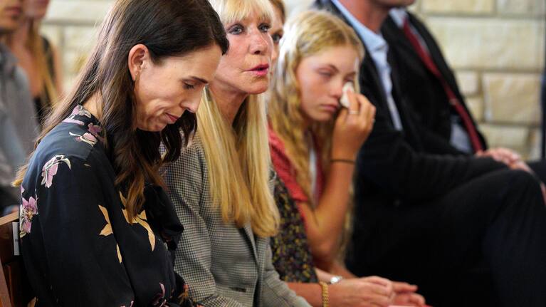 Jacinda Ardern sitting next to Yvonne Moore.