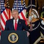 President Donald Trump speaks to business leaders at a dinner event in Tokyo.