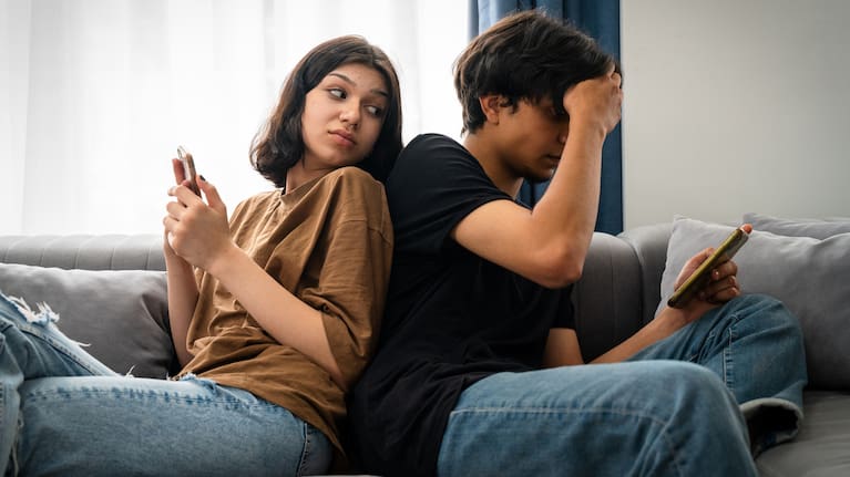 File image of couple on their phones