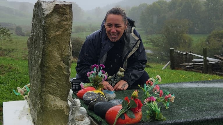 Jenny-May visiting her tupuna and father's grave.