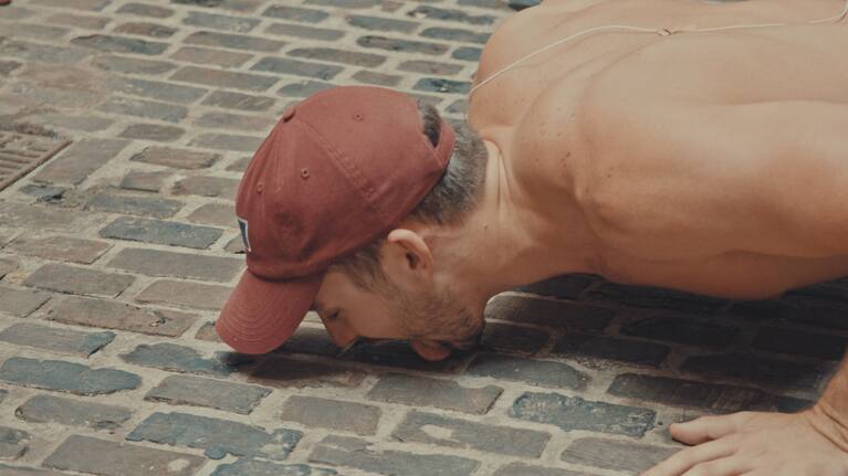 Jesse Williamson licks the floor in a dare.