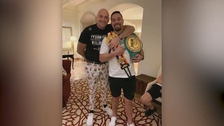 Joseph Parker celebrates with Tyson Fury