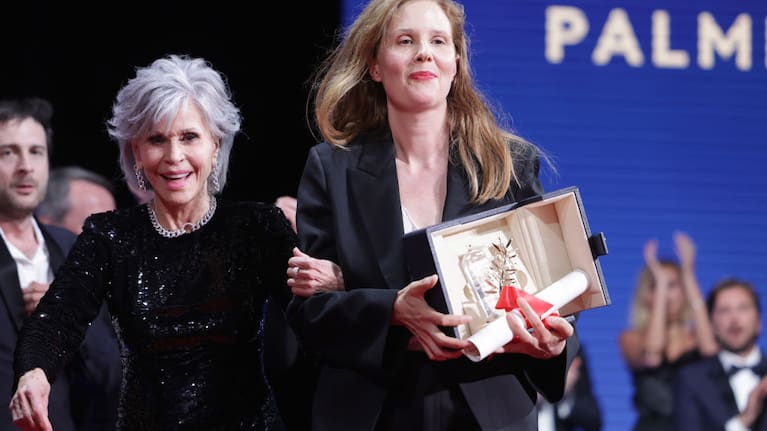Justine Triet (R) receives The Palme D'Or Award for 'Anatomy of a Fall' from Jane Fonda