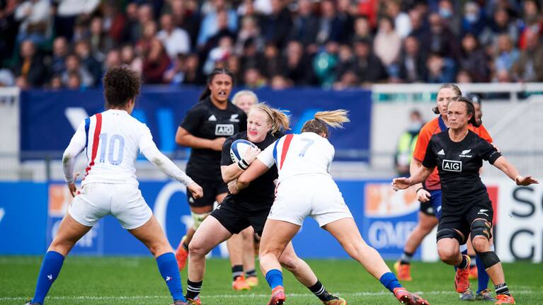 Kendra Cocksedge of the Black Ferns is tackled against France.