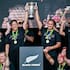 Black Ferns co-captains Kennedy Simon, left, and Ruahei Demant lift the World Cup after their dramatic final victory over England last year.