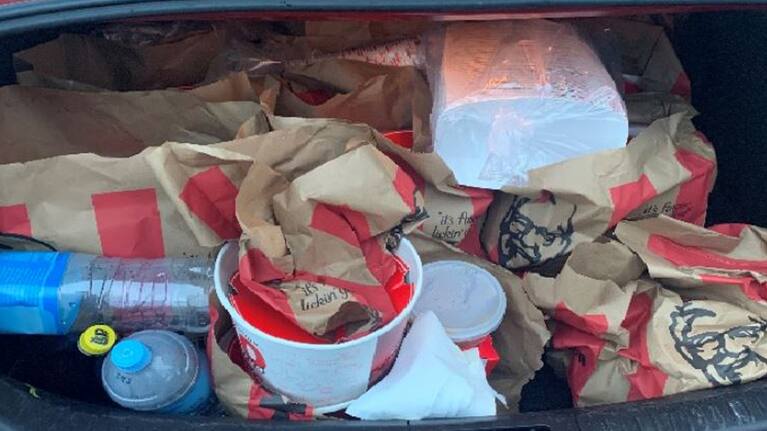 KFC found in car boot of gang associates by police.