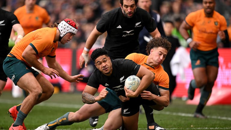Dangerous All Blacks wing Leicester Fainga'anuku is tackled in Dunedin.