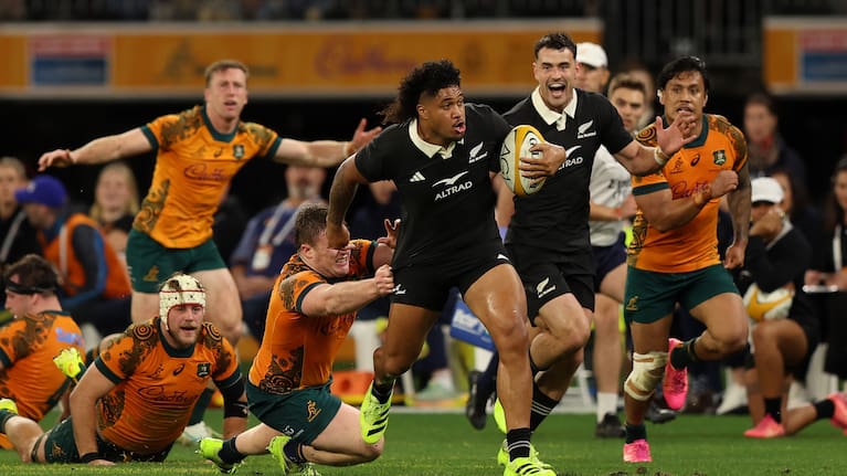 Leicester Fainga'anuku leaves the Wallabies defence scrambling in Perth.