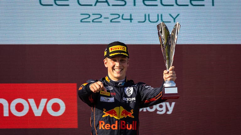 Liam Lawson celebrates his victory in France.
