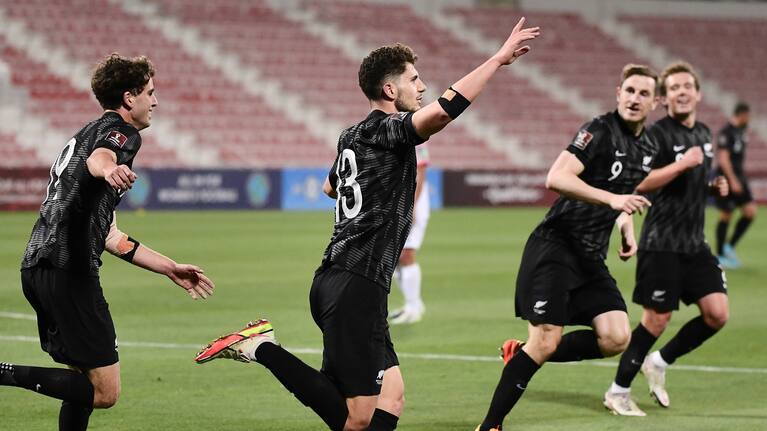 Liberato Cacace celebrates a goal.