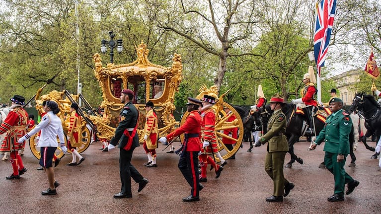 Lieutenant Jessica Hansen marches alongside the Gold State carrige.