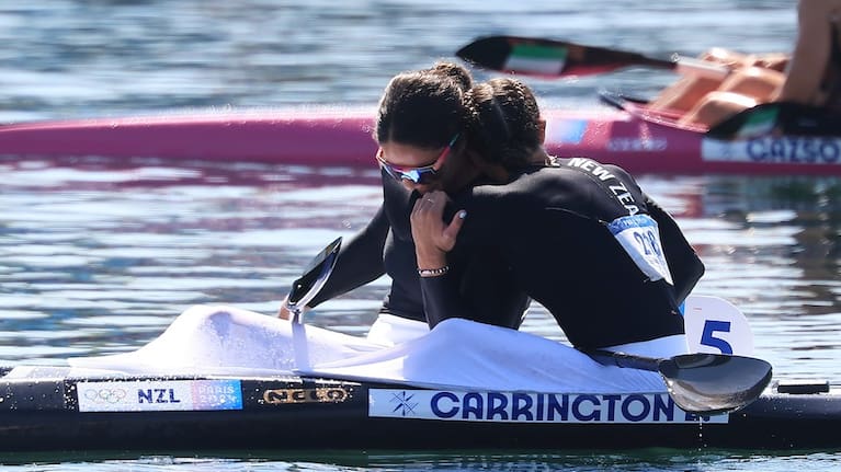 Lisa Carrington and Aimee Fisher share a moment after the K1 500 final.
