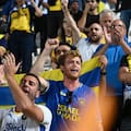 Maccabi Tel Aviv's fans clap hands after the end of the Europa League soccer match.