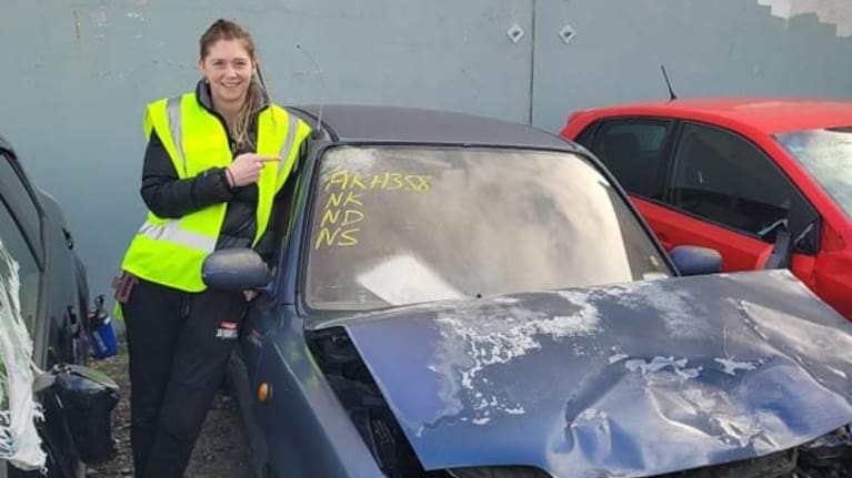 Mary Goulding stands next to her car after her horrific accident in May.