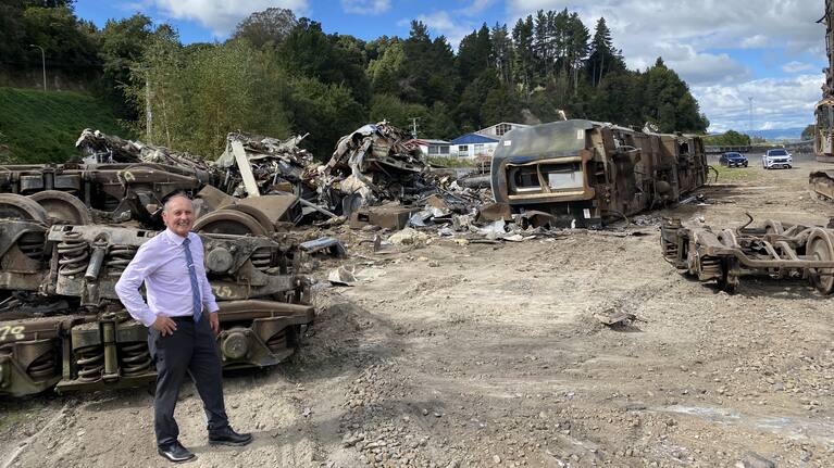Mayor Weston Kirton alongside the scrapped AT carriages.