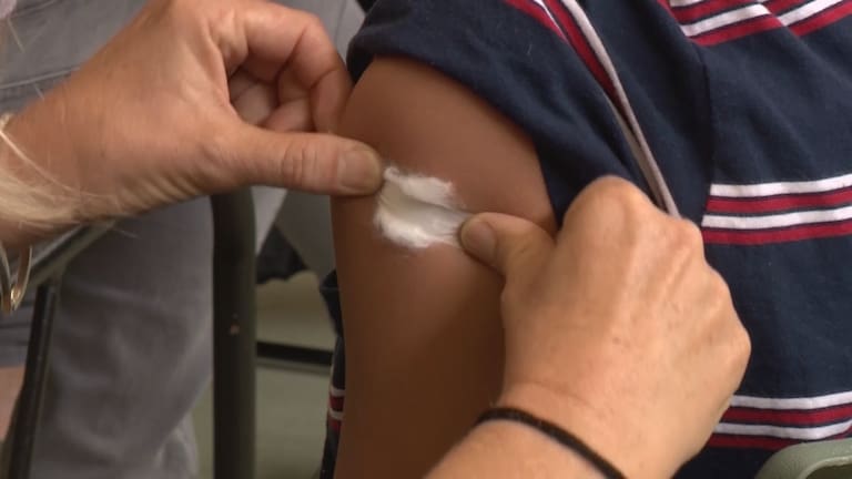 Auckland Grammer closes classroom amid rising cases and concern about vaccination rates.