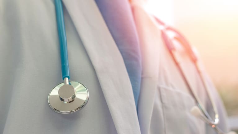 Medical doctor with stethoscope, file.