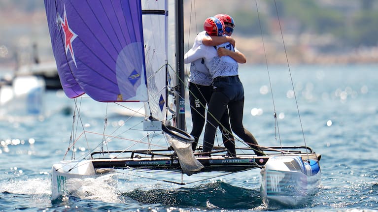 Micah Wilkinson and Erica Dawson of New Zealand celebrate winning the bronze medal of the Mixed Multihull Sailing, during the Olympic Games Paris 2024.