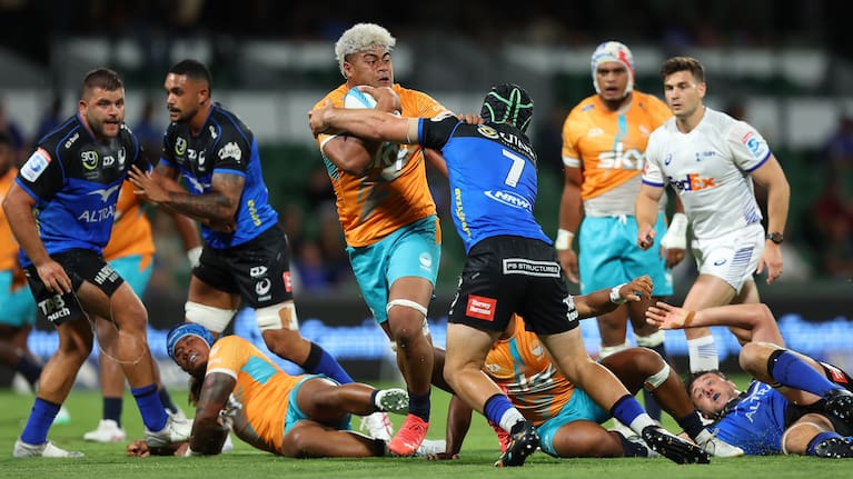 Moana's Lotu Inisi runs with the ball against the Force.