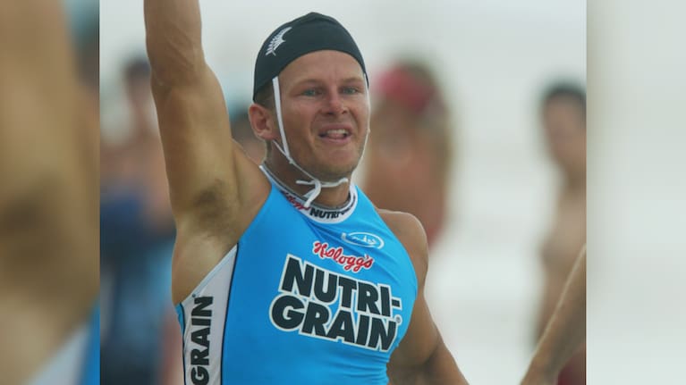 Morgan Foster celebrates victory at the Ironman event held in Coolum Beach, Queensland in 2003.