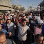 Mourners carry the bodies of Palestinians killed by Israeli fire during their funeral in Deir al-Balah, Gaza, Monday October 19, 2025.