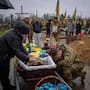 Natalia cries at the coffin of her son Ruslan Zhygunov, a Ukrainian serviceman, who was killed at the frontline near Rusyn Yar village, during his funeral ceremony in Hostomel, Ukraine