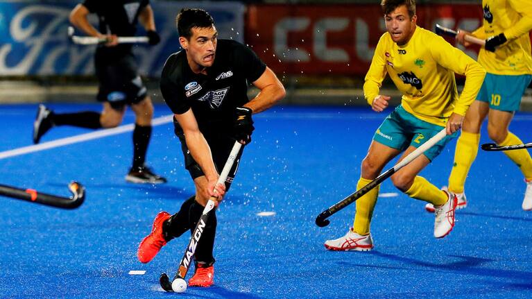 Nick Ross controls the ball for the Black Sticks men.