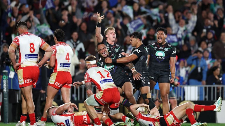 The Warriors celebrate against the Dolphins.