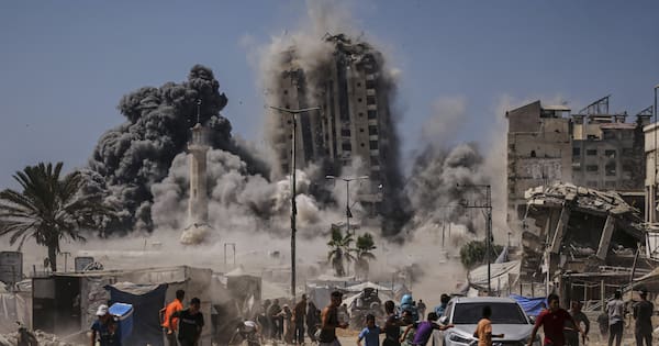Israel strikes Gaza City high-rise, threatens to hit more in offensive