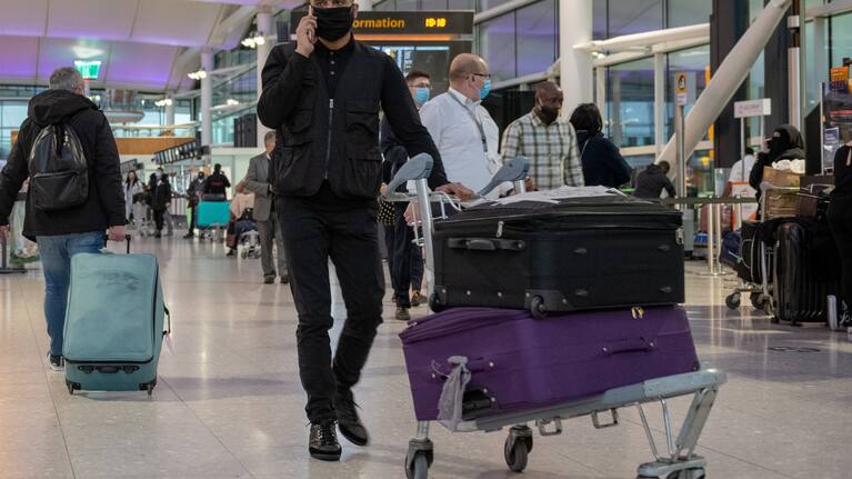Passengers heading to the departure gates at London's Heathrow Airport.