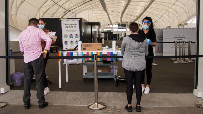 People collecting rapid antigen tests in Auckland.