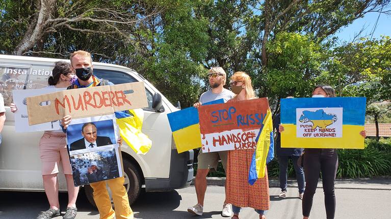 People protesting outside the Embassy of Russia in Wellington on Friday.