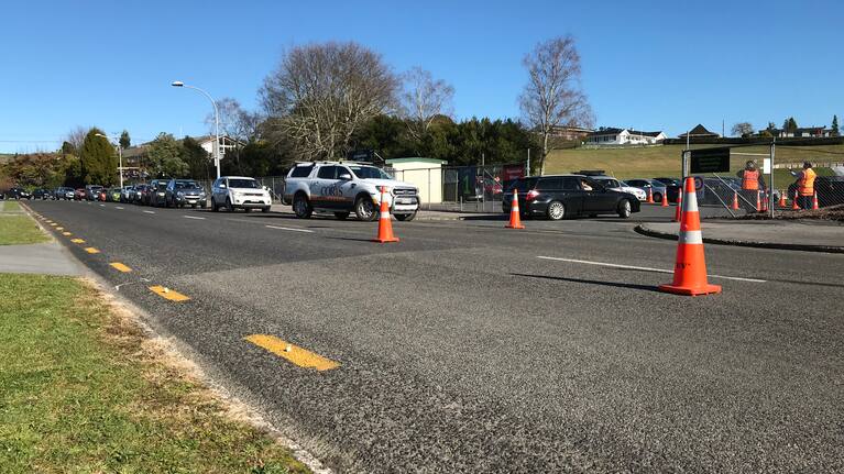 People queue in their car for a test at Rotorua International Stadium on August 13
