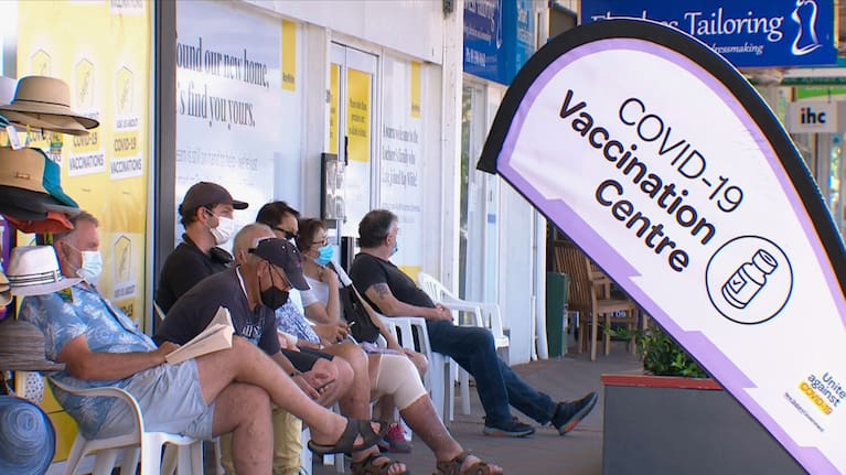 People wait in line for a Covid-19 vaccine (file photo).
