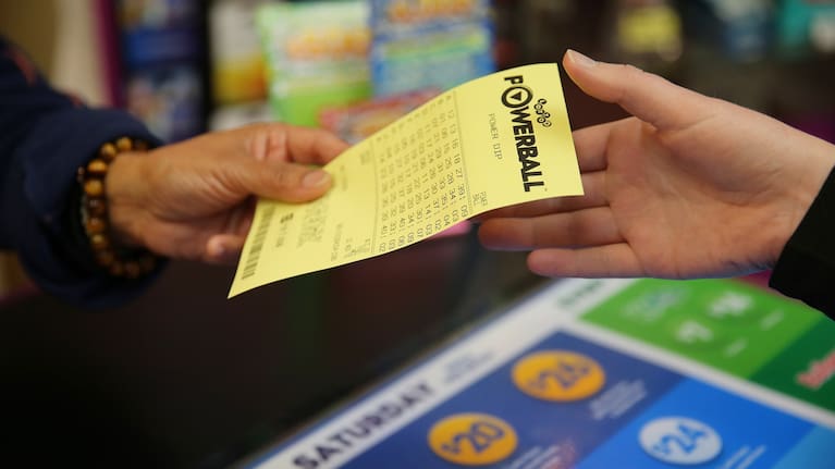 Person buying a lotto ticket.