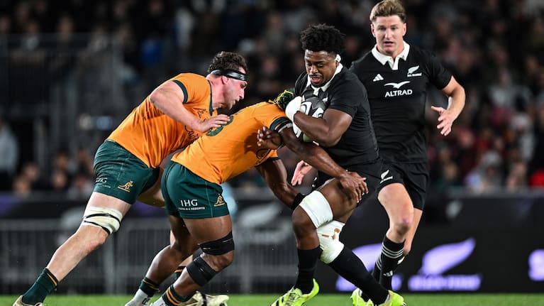 All Blacks loose forward Peter Lakai is tackled by the Wallabies at Eden Park.